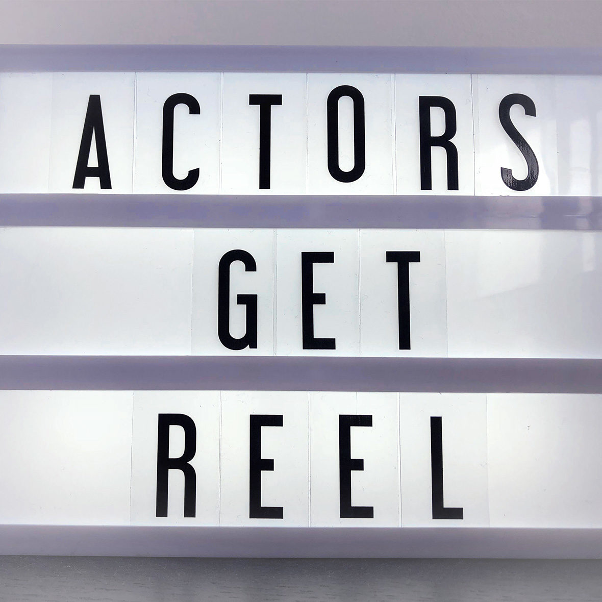 Lightbox with black letters saying "Actors Get Reel".