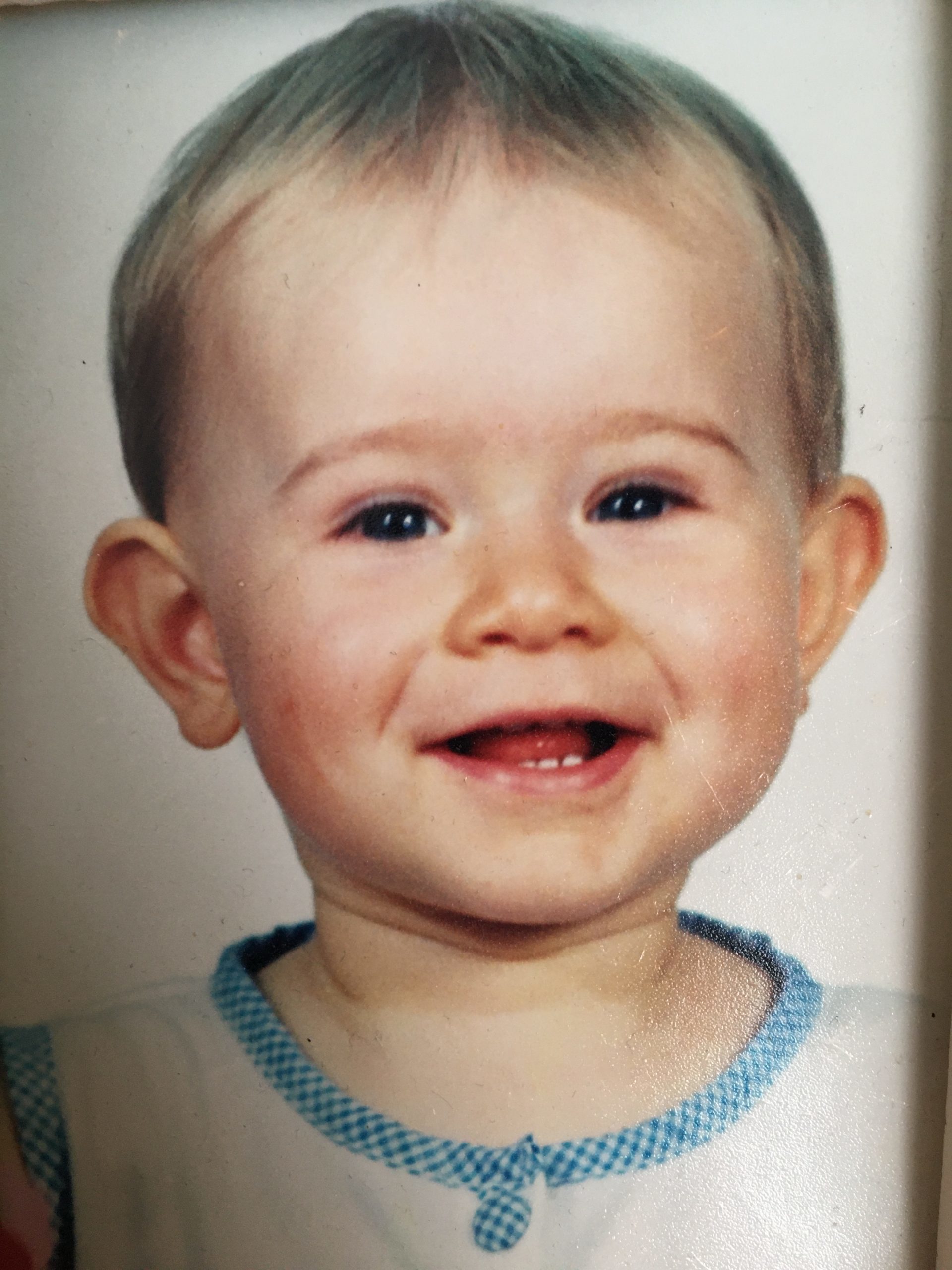 Smiling boy as a toddler.