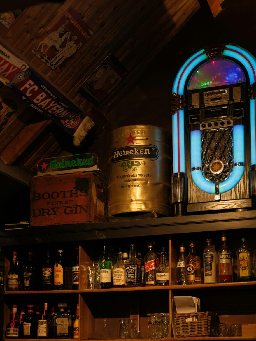Photo of rustic bar shelves stocked with different bottles